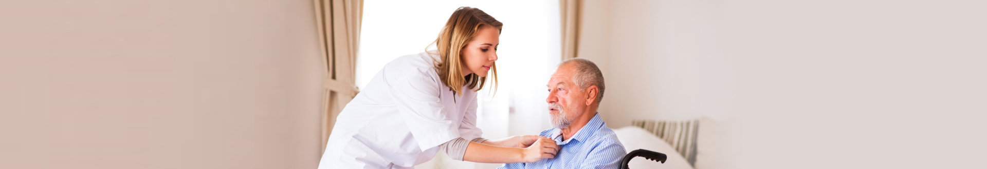 female caregiver assisting senior man